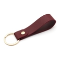 Modern reddish brown PU leather keychain with gold metal ring and rivet on white background - Wine Red & Gold