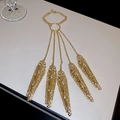 Detailed view of gold hollow flower slave bracelet with five finger rings and wrist chain - Gold-Round