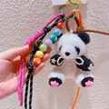 Porte-clés panda en peluche avec perles colorées et corde tressée en gros plan - 39.A2 Panda Étoile Rose