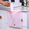 Pink waterproof adhesive car trash bag with rabbit design shown hanging on a drawer handle - Set of 15 / Light Pink Fox