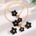 Golden snake chain necklace and stud earrings set with 3D black floral textured pendants - Black 3-Piece Set: Earrings + Anklet + Necklace