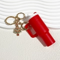 Red mini cup keychain with Christmas tree charm and gold hardware on white background - Christmas Red