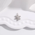 S925 sterling silver snowflake pendant with zircon crystals on a white wave tray - White Gold