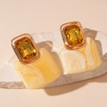 Close-up of vintage resin earrings with yellow crystal and marble pattern texture - Milkshake Yellow Textured Square / Yellow (Silver Earring Post)