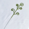 Macro detail of sparkling green glitter spiral branch pick for Christmas festive decor - Green