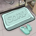 Modern light green diatom mud bath mat with 3D embossed SOAP text and black edges - Soap Mint