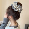 Chouchou élégant avec dentelle et motif pied-de-poule pour coiffure chignon chic - Chouchou en dentelle à carreaux noirs