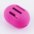 Mini silicone facial brush in rose pink finish with oval shape and ventilation slots - Storage Box Horizontal Hole / Rose Red
