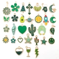 Green enamel and gold alloy charms set featuring star and leaf shapes for DIY jewelry - Green Enamel Mix (HK553)