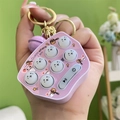 Pink mini whack-a-mole toy keychain with a cartoon hamster design and purple bell charm - Whack-a-mole Machine - Purple
