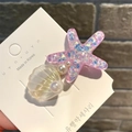 Pink glitter starfish hair clip with shells and pearls on a display card - Curved Shell Starfish / Purple
