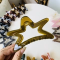 Detail of amber translucent star hair claw clip with durable metal spring and grip - 11cm / Jelly Yellow Green