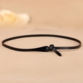 Minimalist black leather skinny belt for women with elegant knot closure design - Black