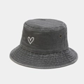 Detail view of heart embroidery and washed texture on a charcoal gray cotton bucket hat - Gray