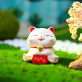 Miniature white cat figurine with red scroll on green moss for home desk decoration - Longing for Wealth Lucky Cat