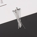 Macro shot of silver stainless steel ball head pins for DIY jewelry making and beading - 0.6*30mm / Ball Head Pin Steel Color