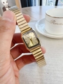 Close-up of elegant gold square dial quartz watch with flexible metallic expansion band - Gold Dial / Gold