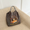 Detail of dark gray nylon bag featuring fine cat embroidery and black-white checkered handle - Grey Chocolate Cat