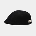 Detail of a vintage black wool beret featuring a stylish white JISIZAN.LING side woven label - One Size / Black