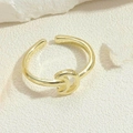 Macro shot of gold adjustable crescent ring showcasing polished metal texture and finish - Crescent Moon Ring