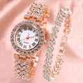 Close-up of rose gold watch and heart bracelet set on pink silk background - Rose Gold Watch And Bracelet