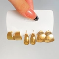 Detail of three pairs of gold geometric earrings with brushed and honeycomb textures - 21 KC Gold (6505)
