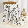 Detail of soft cotton muslin baby blanket with forest fox print and tassel edge trim - Forest