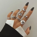 7pcs Gothic silver rings set featuring skull spider snake and butterfly motifs on hand - Gothic Bat And Skull Spider Style (XT-14328)