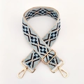 Close-up of ethnic jacquard strap with geometric patterns and golden metal swivel hooks - Light Blue Dark Blue Floral
