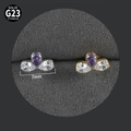 Macro detail of G23 titanium labret studs with purple and white pear zircon clusters - Pear Cluster NO-13