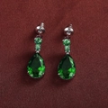 Elegant emerald-green pear-cut cubic zirconia drop earrings with silver-tone setting - Green