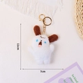 Cute white plush dog keychain with brown ears and blue eyes, height 11cm width 7cm - White Screaming Dog (Gold Keychain)