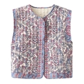 Detail of V-neck quilted vest showing floral print texture and fine stitching - S / Tops / Blue Floral