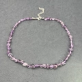 Detail showing natural amethyst irregular stones on a stainless steel chain necklace - Light Amethyst