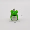 Detail showing 22mm x 15mm dimensions of a green cartoon frog acrylic pendant - Frog