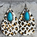Detail view of teardrop earrings featuring leopard print hair and turquoise stone inlay - Leopard Pattern Leather