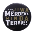 Round black tinplate badge with white and gold Jiwa Merdeka Minda Terbuka lettering - JIWA MERDEKA MINDA TERBUKA