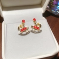 Close-up of gold rocking horse earrings with red enamel and sparkling crystal details - 15# Silver Earring Post Gold Color Red