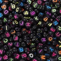Macro shot of colorful alphabet letters on round black acrylic beads for DIY jewelry making - 4x7mm Black With Colored Letters (100pcs)