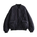 Close-up of onion-quilted black bomber jacket with snap buttons and utility pockets - XS / Black