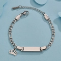 Detail of stainless steel Figaro chain bracelet with crown charm and engravable ID plate - Steel Crown Style
