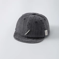 Close-up of a dark grey washed denim baby cap with white embroidery and soft brim detail - 44-50cm (1-2 Years) / Black