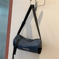 Dark blue cylinder crossbody bag with adjustable black strap and mesh side pocket - Blue
