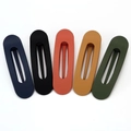 Detailed view of 5-piece matte finish oval hollow hair clips in assorted earth tones - Set 8 (5-Piece Set: Matte Hollow Hair Clips)