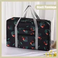 Black travel bag featuring pink flamingo and palm leaf print with grey carry handles - Black Flamingo