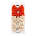 Set of 4 textured fabric bow hair clips in red and beige on white display card - Red/Beige