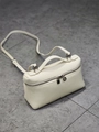 White pebbled leather handbag with top handle, silver hardware and adjustable strap - White