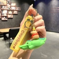 Cute Capybara keychain featuring a capybara on a green crocodile with yellow wrist strap - B241-8 Crocodile