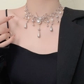 Spider pearl necklace with silver water drop pendants worn on a black blazer - Spider Shape Artificial Pearl Necklace (DX0445) / Silver
