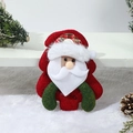Dettaglio di Babbo Natale in peluche con pelliccia sintetica e tessuti verdi natalizi - Babbo Natale
